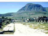 Corinth - Lechaeun Road, with the hill of the Acropolis of Corinth